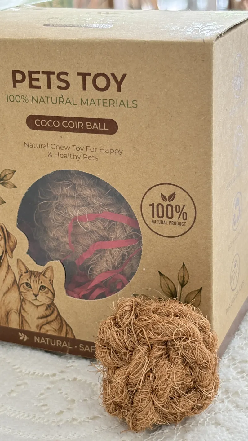 Coco coir ball beside its printed kraft retail box