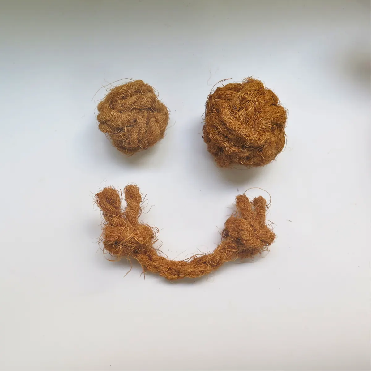 Coco coir balls and a knotted coir rope