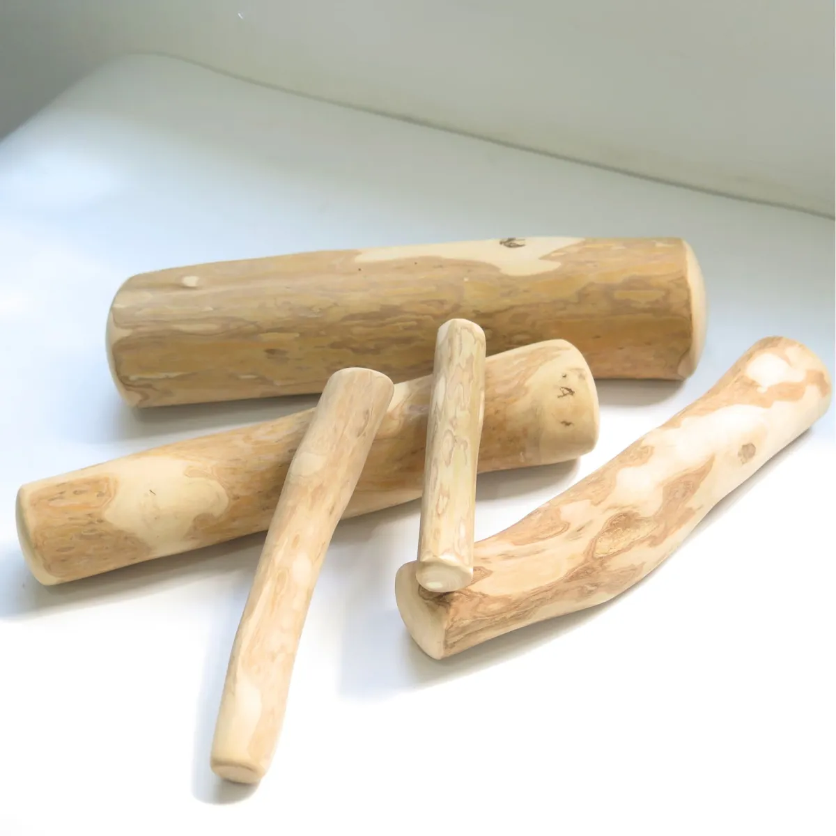 Finished coffee wood dog chews in several sizes