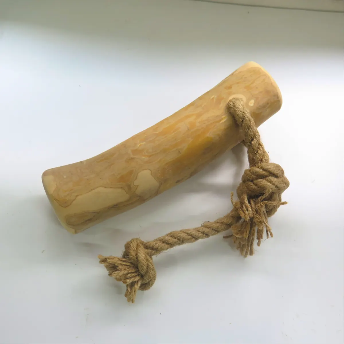 A coffee wood stick with a knotted hemp rope