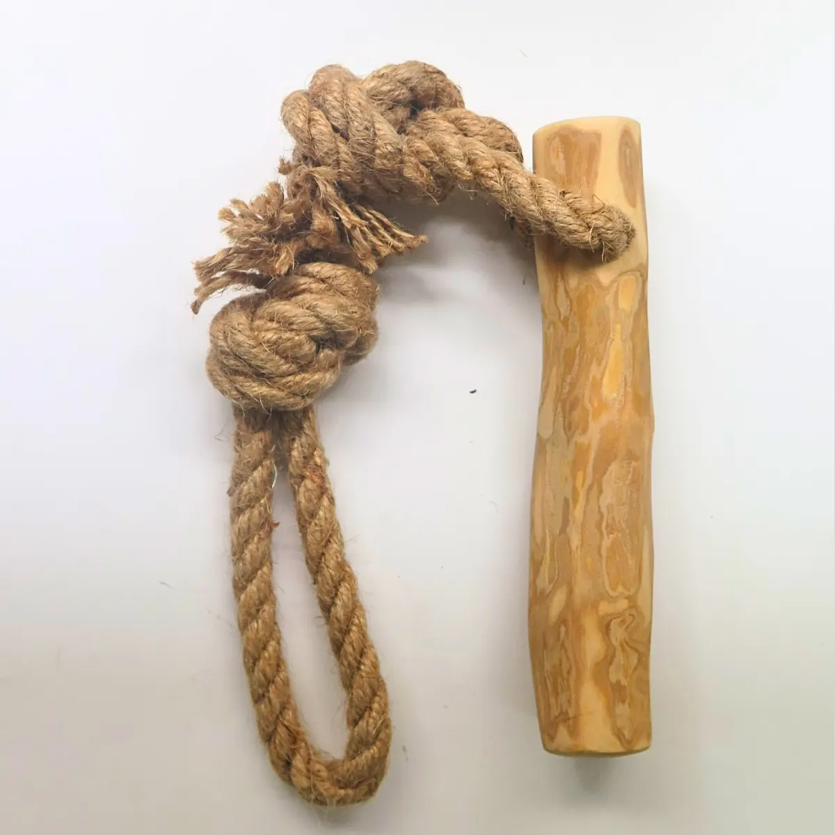 A hemp rope loop knotted through a coffee wood stick